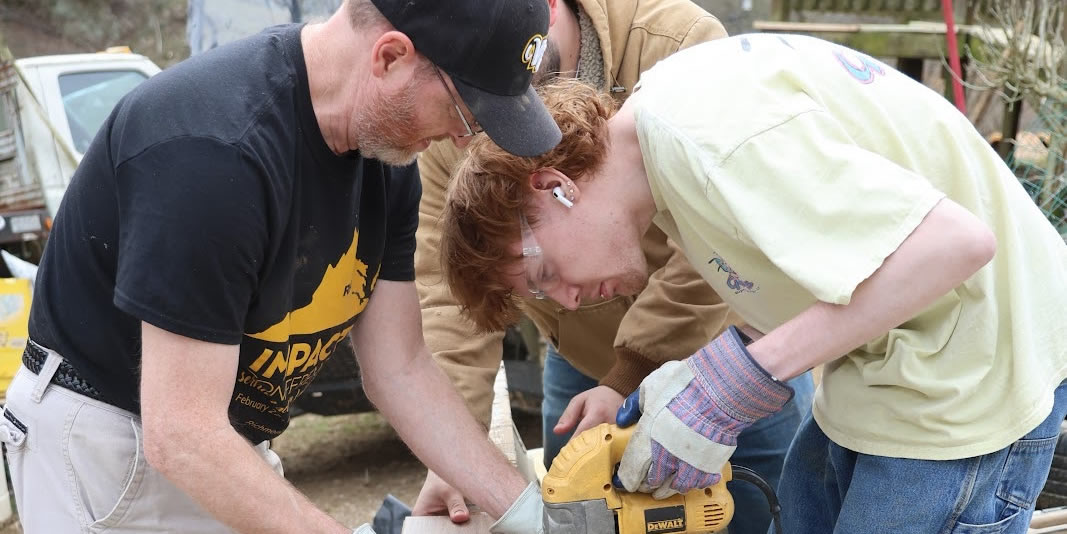 group students working with tools